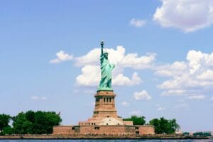 The Statue of Liberty standing on Liberty Island in New York Harbor, symbolizing freedom and opportunity. What Are Stocks and How Do They Work?