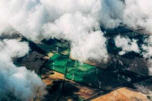 Aerial view of wind turbines and solar farms, symbolizing Vistra’s transition to renewable energy. Learn whether Vistra is a good stock to buy before its Q4 earnings.