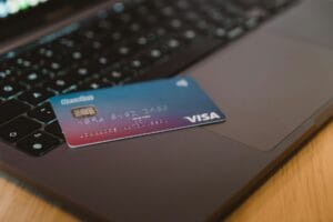 Visa credit card on a laptop keyboard, representing digital payments and financial transactions. Is Visa a Good Stock to Buy in 2025?