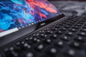 Close-up of a Dell laptop keyboard with a vibrant screen - Is Dell a Good Stock to Buy Now?